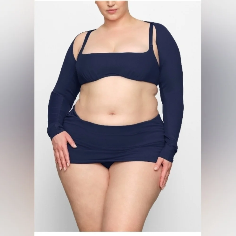 Skims sculpting swim long sleeve shrug.